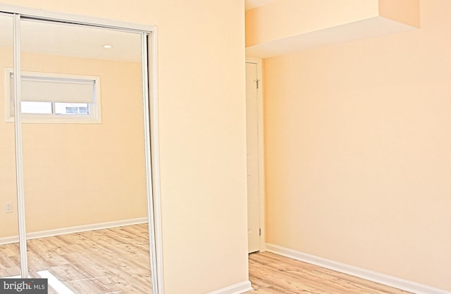 interior space with light wood-style flooring and baseboards