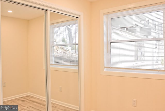 entryway featuring light wood-type flooring and baseboards