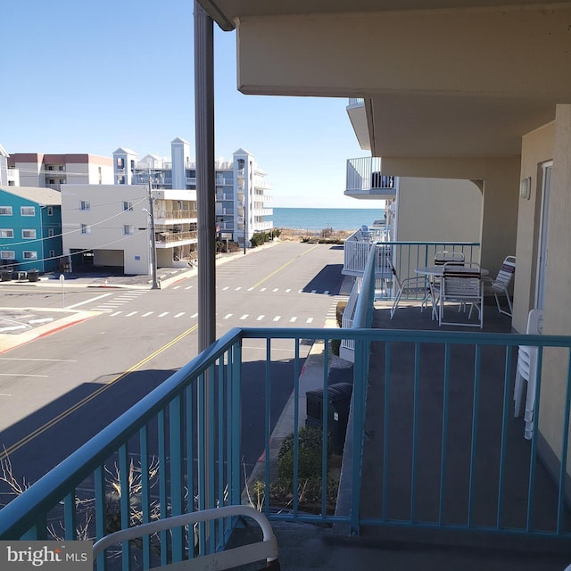 balcony featuring a water view