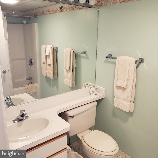 full bath with  shower combination, vanity, and toilet