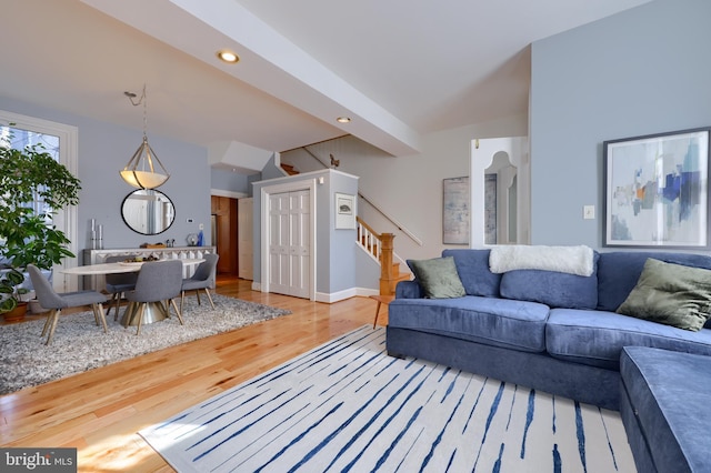 living room with stairway, recessed lighting, baseboards, and wood finished floors