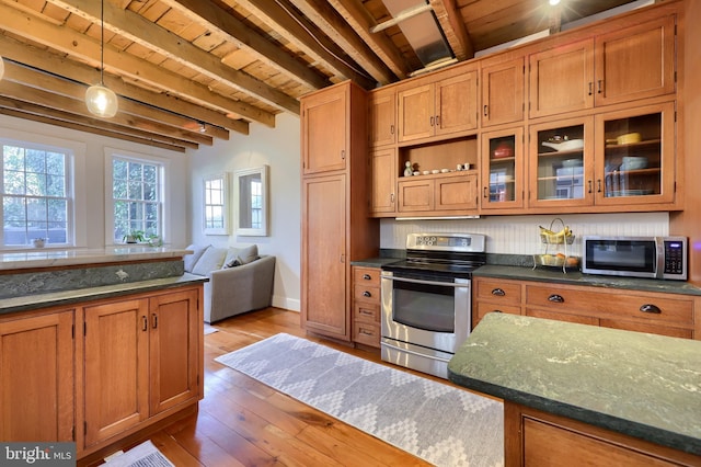 kitchen featuring beamed ceiling, wood ceiling, hardwood / wood-style floors, brown cabinetry, and stainless steel appliances