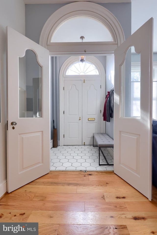 foyer entrance with light wood-style floors