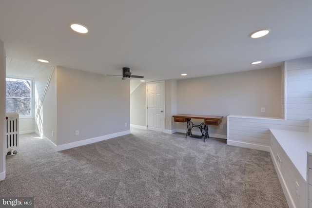 below grade area with baseboards, recessed lighting, a ceiling fan, and carpet