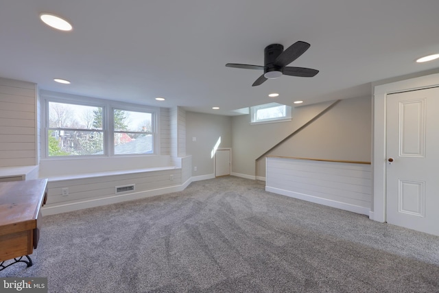 basement featuring visible vents, baseboards, carpet flooring, recessed lighting, and a ceiling fan