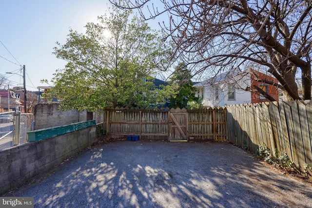 exterior space with a gate and fence