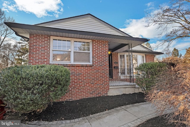 view of front of home with brick siding