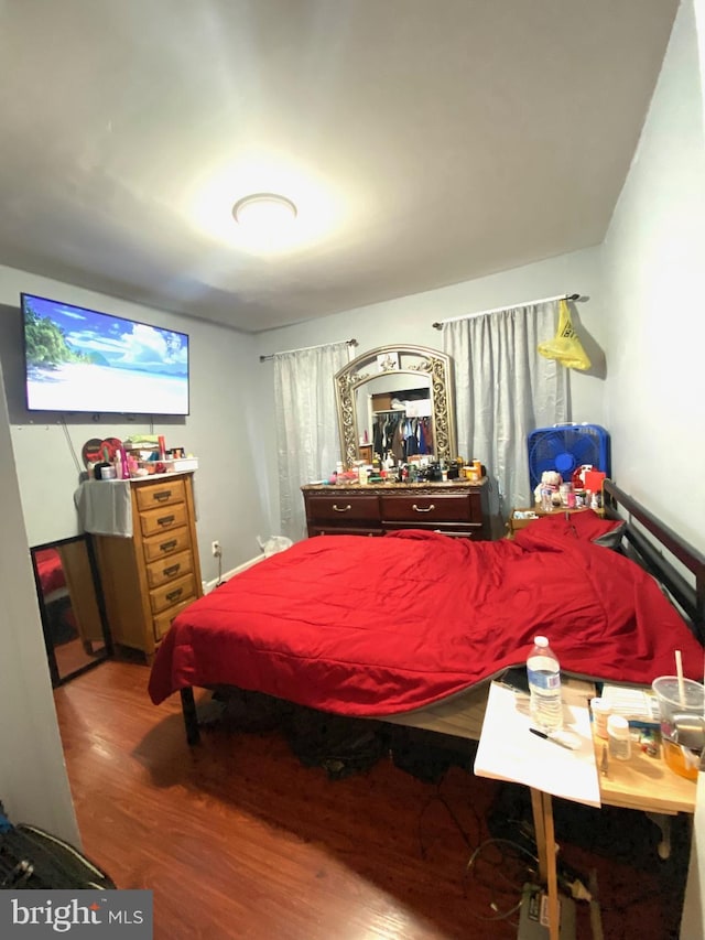 bedroom featuring wood finished floors