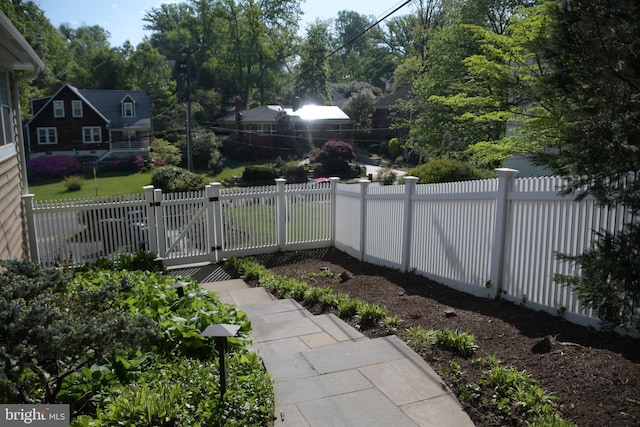 view of yard with a gate and fence