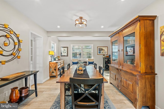 dining area featuring a chandelier, recessed lighting, baseboards, and light wood-style floors