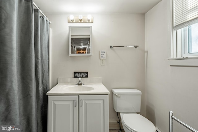 full bathroom featuring vanity and toilet