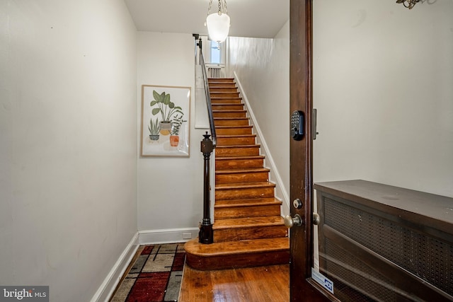 stairs featuring baseboards