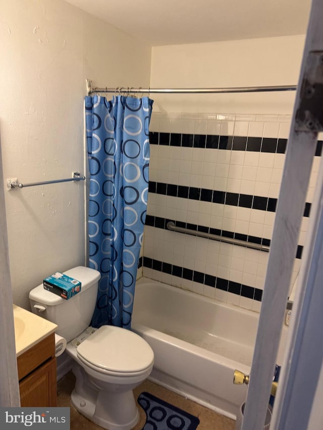 full bathroom featuring toilet, shower / tub combo with curtain, and vanity