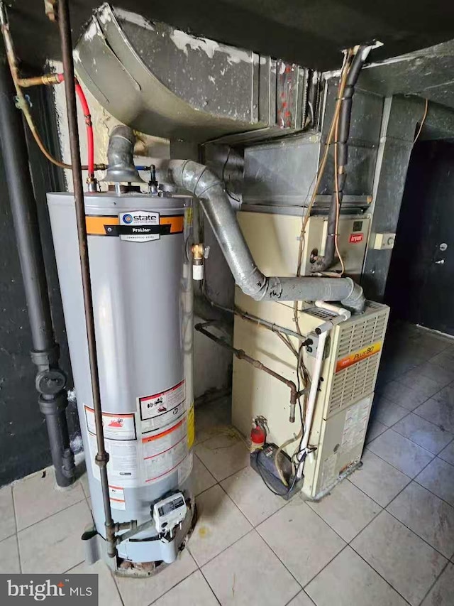 utility room featuring water heater