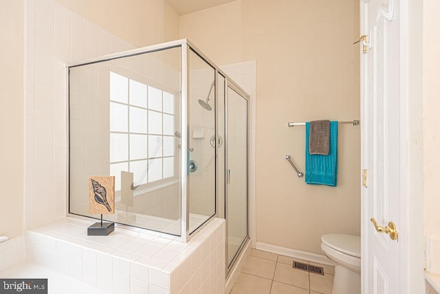 full bath with tile patterned flooring, visible vents, a shower stall, and toilet