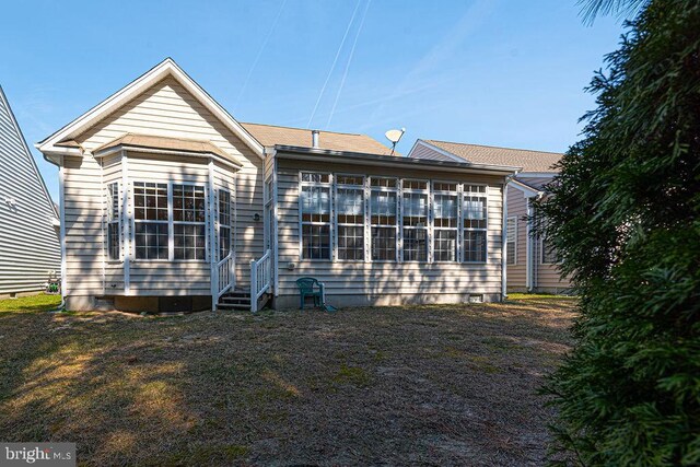 rear view of house featuring entry steps