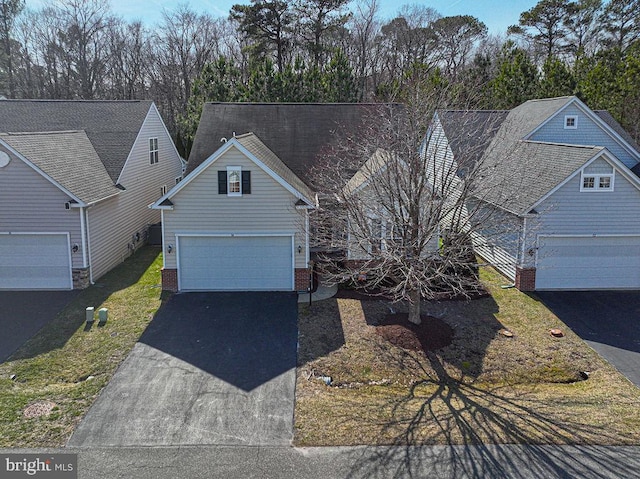 view of front of property featuring a garage and driveway