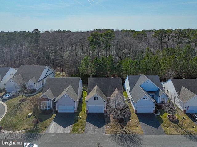 bird's eye view with a residential view and a view of trees