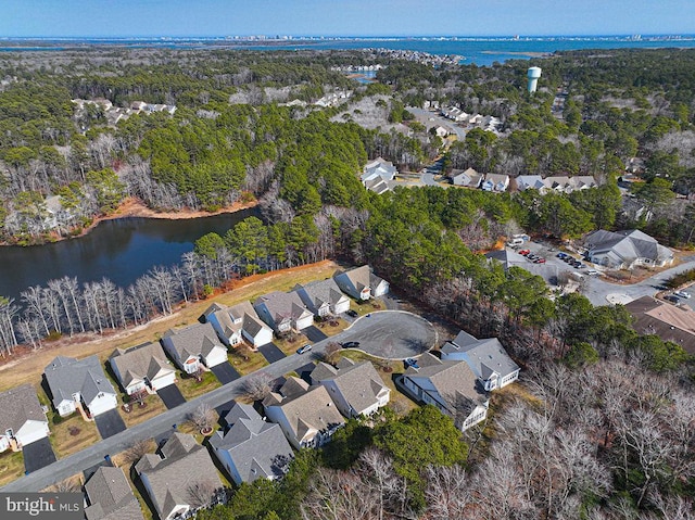 birds eye view of property with a residential view and a water view