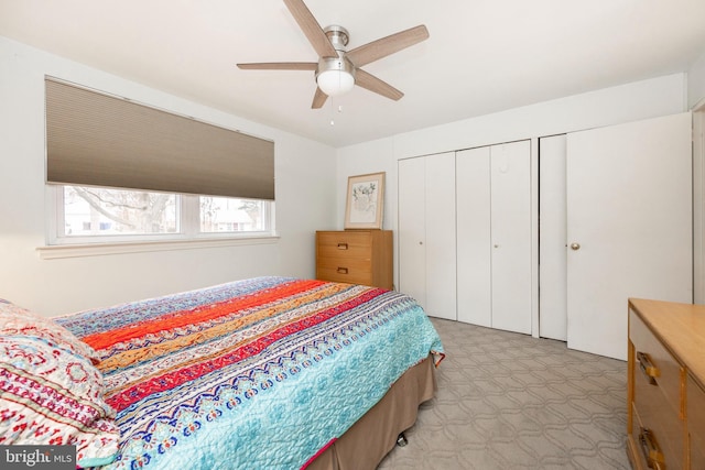 bedroom with a ceiling fan and light floors