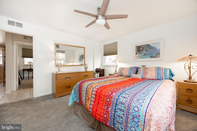 bedroom with a ceiling fan, baseboards, visible vents, and carpet flooring