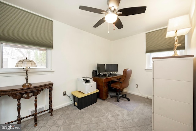 office area with visible vents and baseboards