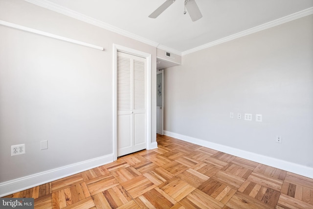 unfurnished bedroom with crown molding, visible vents, baseboards, and a closet