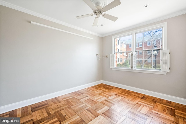 empty room featuring baseboards, ceiling fan, and crown molding