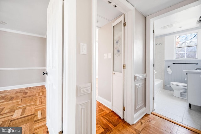 hall featuring visible vents and baseboards