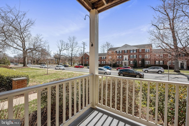 balcony featuring a residential view and a porch