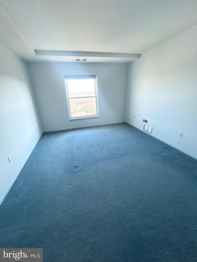 carpeted empty room with visible vents