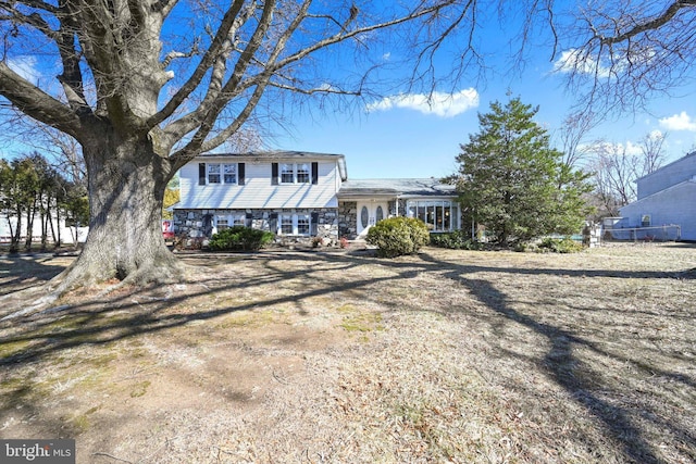 split level home with stone siding