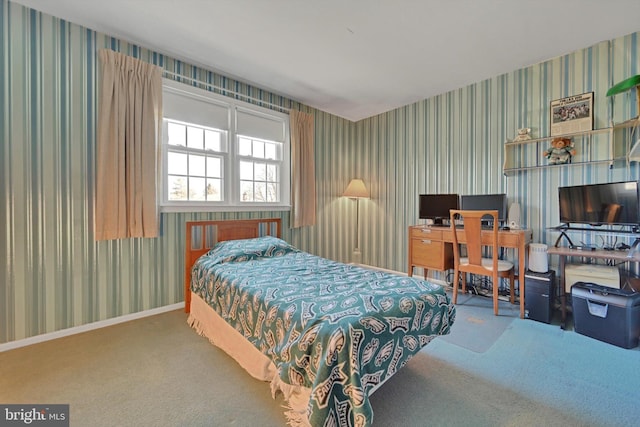 bedroom featuring wallpapered walls, baseboards, and carpet floors