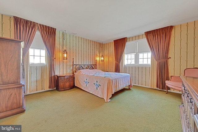 carpeted bedroom with wallpapered walls