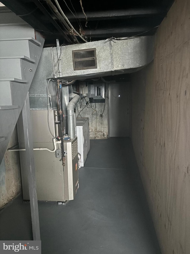 unfinished below grade area with washer / dryer and visible vents