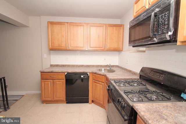 kitchen with black appliances, a sink, light countertops, light tile patterned floors, and decorative backsplash