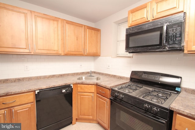 kitchen with light tile patterned flooring, black appliances, light brown cabinetry, and a sink