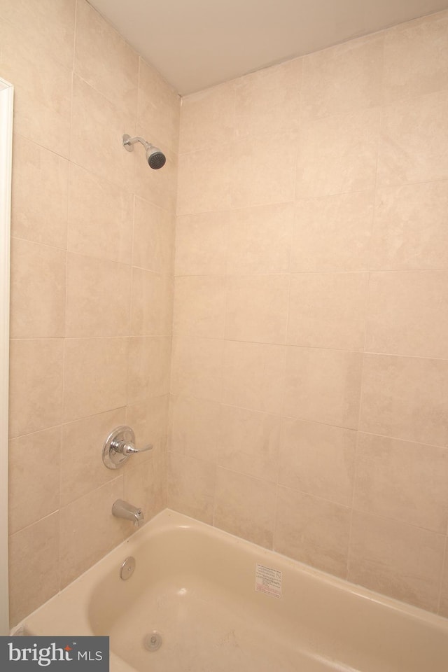 bathroom featuring washtub / shower combination