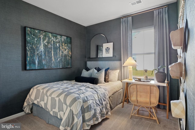 bedroom with carpet, visible vents, and baseboards