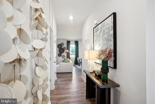 hall with dark wood-style floors and recessed lighting