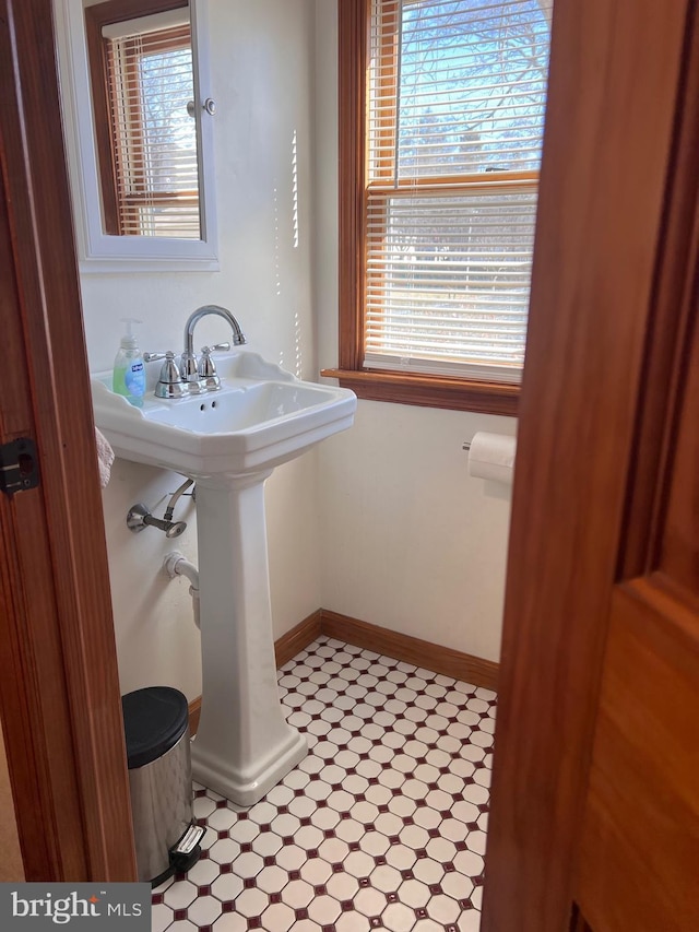 bathroom featuring baseboards and tile patterned floors