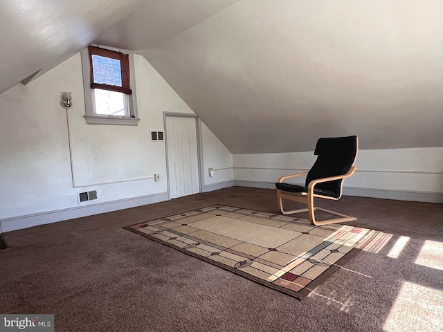 bonus room with lofted ceiling, carpet flooring, and visible vents