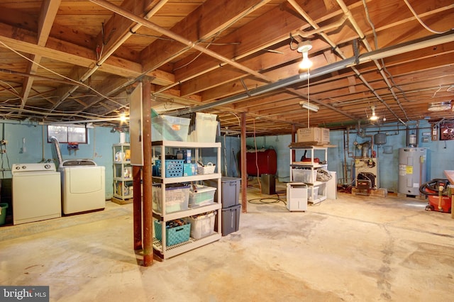 basement with washer and dryer, electric water heater, and a heating unit