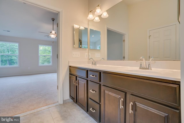 bathroom with tile patterned floors, a sink, ceiling fan, and visible vents