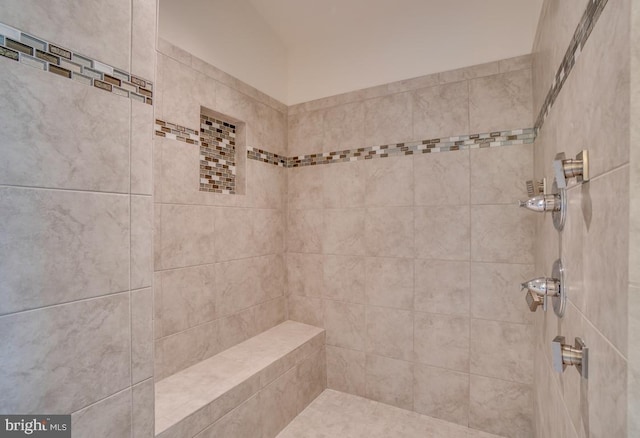 full bathroom with a tile shower