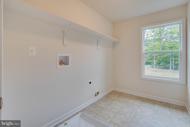 clothes washing area featuring washer hookup, baseboards, laundry area, and hookup for an electric dryer
