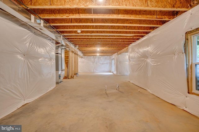 basement featuring heating unit