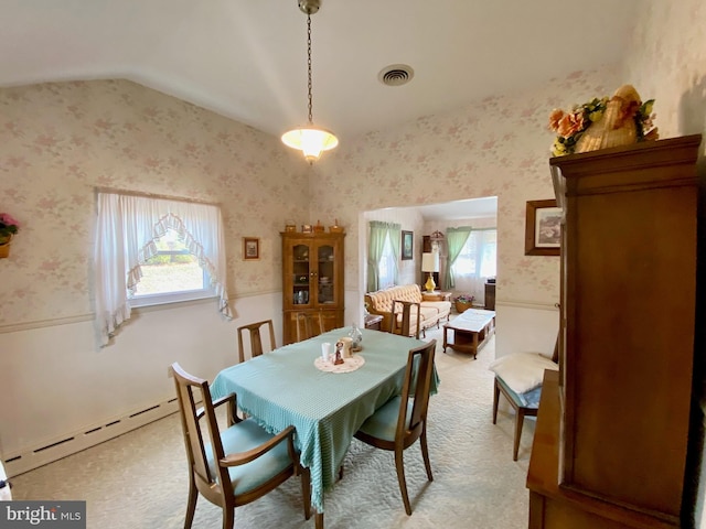 dining area with a baseboard radiator, light carpet, visible vents, vaulted ceiling, and wallpapered walls