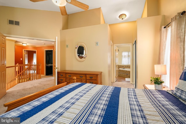 unfurnished bedroom featuring ensuite bathroom, carpet floors, a towering ceiling, and visible vents