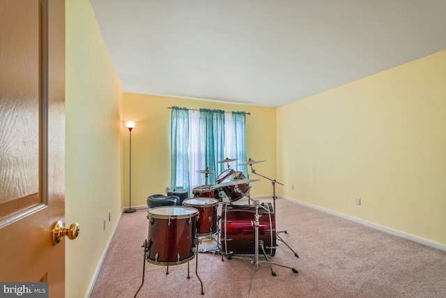 game room with carpet flooring and baseboards